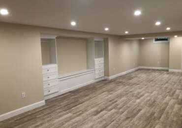 Transformative Basement Finishing with Custom Storage by Sun Shore Construction