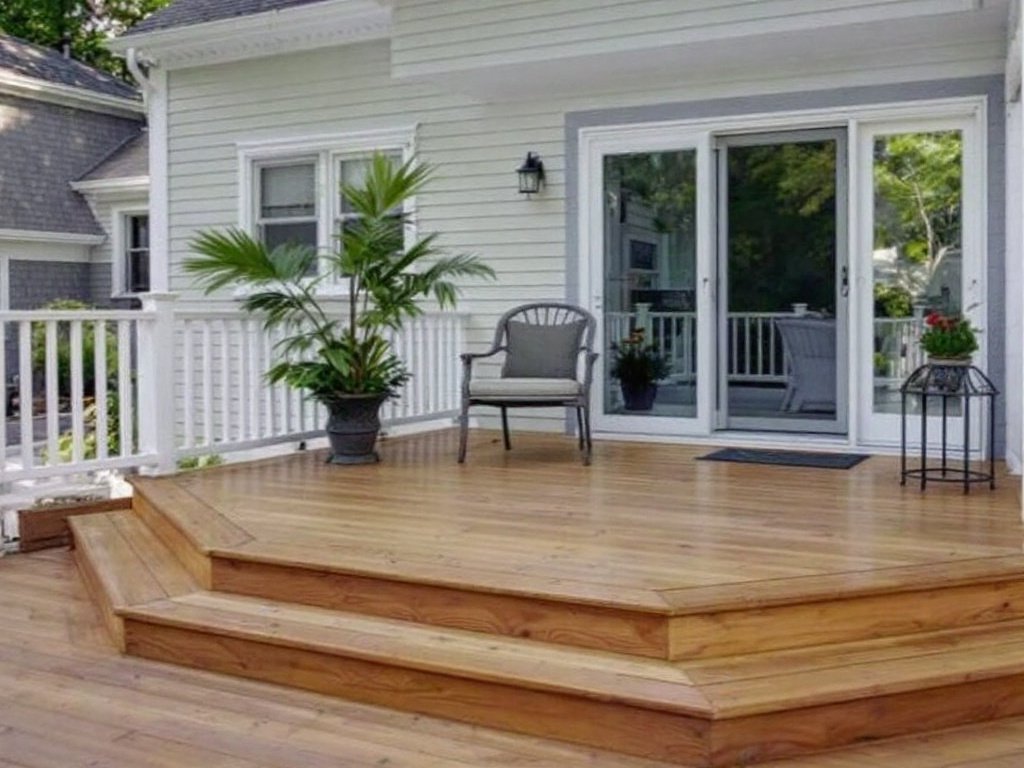 A picture of a newly installed deck in Welley, MA, showcasing modern and contemporary design.